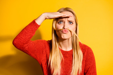 Close-up portrait of her she nice-looking cute attractive lovely crazy fool girl making curls fake mustache looking far away isolated over bright vivid shine orange background