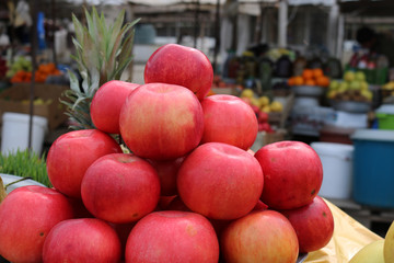 Red apples at the fair or at the bazaar