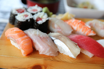 Sushi Set nigiri and sushi maki with tea served on wood and soup , Japanese food