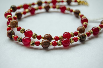 Red beaded jewellery close up