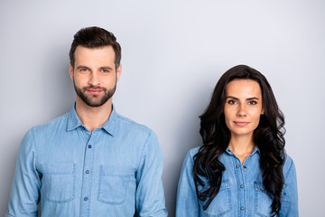 Close up portrait beautiful amazing she her he him his couple lady guy friends stand close look seriously colleagues wear casual jeans denim shirts outfit clothes isolated light grey background
