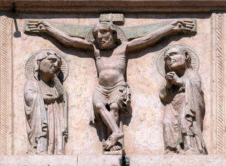 Crucifixion, relief on Facade of Sant`Anastasia Church in Verona, Italy