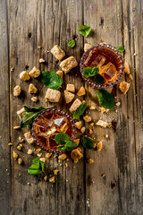Summer iced mint tea. Traditional Moroccan drink  with mint. Rustic wooden background, copy space