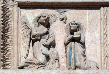 Annunciation of the Virgin Mary, relief on Facade of Sant`Anastasia Church in Verona, Italy