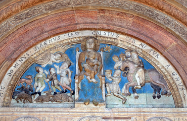 Virgin holding the Christ child, centered between, the Annunciation to the Shepherds and the...