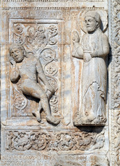 Creation of Adam, medieval relief on the facade of Basilica of San Zeno in Verona, Italy