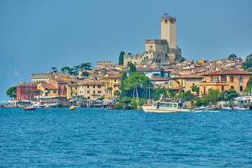 Malcesine,Lago di Garda ,Italy - 13 October 2018: View of the beautiful Lake Garda in Veneto region, Malcesine town and old castle on rock in the summer time, Italy