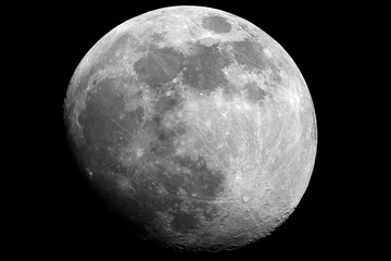 Moon in waxing gibbous phase taken by telescope in th dark space.