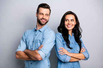 Portrait of charismatic competent coworkers colleagues working doing business freelance standing back-to-back looking inspiring confidence isolated dressed  blue denim clothing argent background
