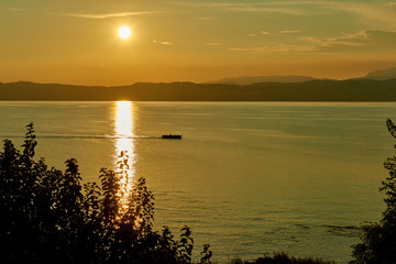 Beautiful sunset in Sirmione the historical town on peninsula in Garda lake, Lombardy, Italy