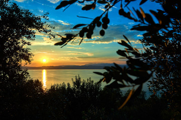 Beautiful sunset in Sirmione the historical town on peninsula in Garda lake, Lombardy, Italy