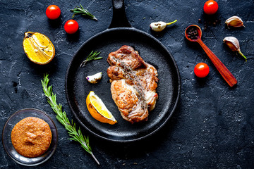 concept cooked steak on dark background top view