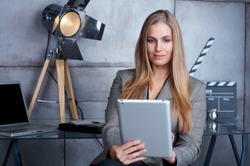 Attractive businesswoman using tablet