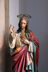 Fototapeta premium Sacred Heart of Jesus, statue on the Our Lady of Mount Carmel altar in the Church of Blessed Virgin of Purification in Smokvica, Korcula island, Croatia