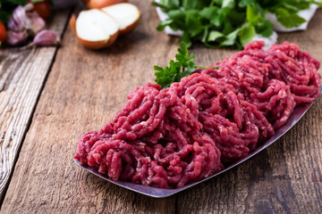 Minced beef, raw ground meat with cooking ingredients
