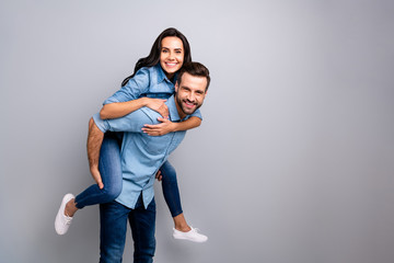 Close up side profile photo funky she her he him his couple lady guy piggyback ride go walk highway adventures soul mood wear casual jeans denim shirts outfit clothes isolated light grey background