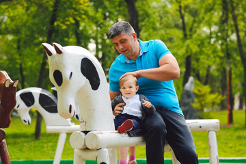 Father and son playing in park