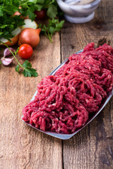 Minced beef, raw ground meat with cooking ingredients