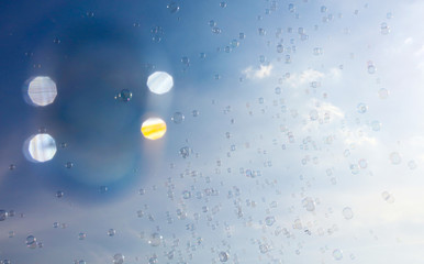 Soap bubbles fly in the blue sky