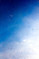 Soap bubbles fly in the blue sky