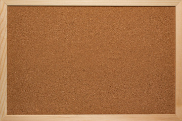 Cork board for notes in a wooden frame