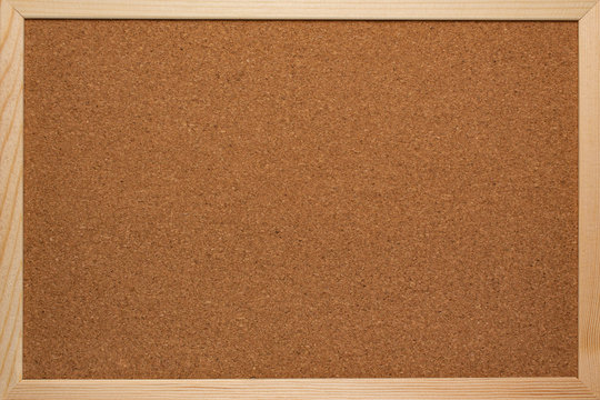 Cork board for notes in a wooden frame