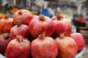 Red pomegranates for sale at a fruit market