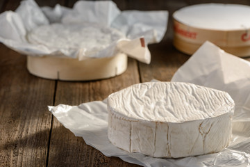 Unpacked Camembert cheese wheel