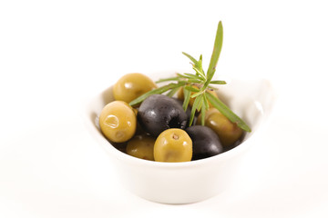 green and black olives on white background