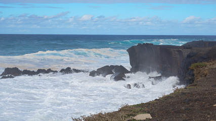 waves crashing on rocks