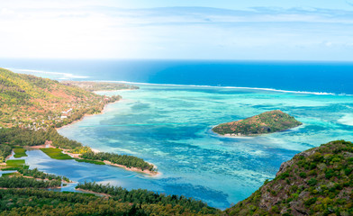 Beautiful view of a tropical beach with crystal clear water from the mountain in le Le Morne Brabant, Mauritius