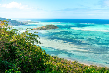 Beautiful view of a tropical beach with crystal clear water from the mountain in le Le Morne Brabant, Mauritius