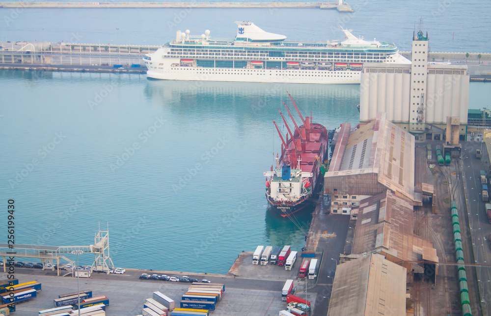 Wall mural Top view of a cargo ship in an industrial harbor in Barcelona, Spain