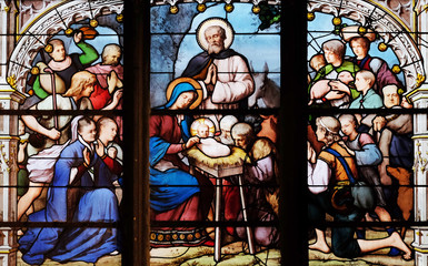 Nativity Scene, Adoration of the Shepherds, stained glass window in Saint Severin church in Paris, France 