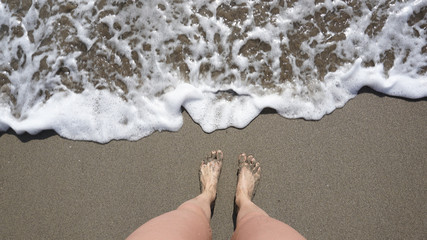 feet on the beach