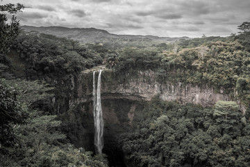 beautiful close view of chamarel waterfall, mauritius on a cloudy day in black e white BW