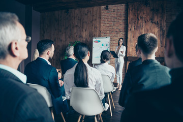 Crowd of nice elegant stylish intelligent sharks listening to presentation new strategy growth...