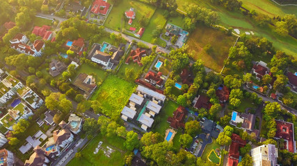 Aerial view of residential neighborhood. Urban housing development from above. Top view. Real...