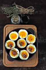 Boiled eggs with herbs and sesame. Keto breakfast or snack. Delicious soft boiled eggs.