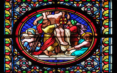 Deposition from the Cross, stained glass window in the Basilica of Saint Clotilde in Paris, France