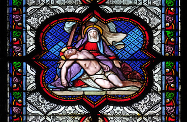 Fototapeta na wymiar Deposition from the Cross, stained glass window in the Basilica of Saint Clotilde in Paris, France