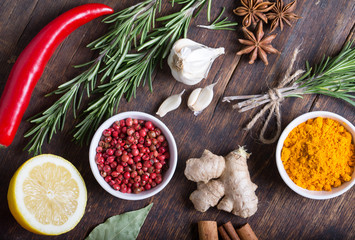 Herbs and spices in ceramic bowls. Aromatic ingredients and natural food additives.