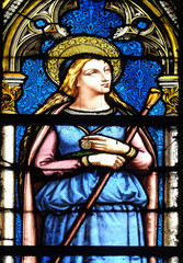 Obraz premium Saint Genevieve, stained glass window in the Basilica of Saint Clotilde in Paris, France 
