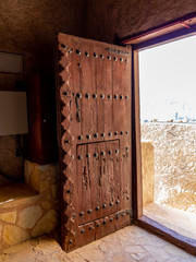 Massive antique door in Fort Muttrah in Muscat, the capital of Oman