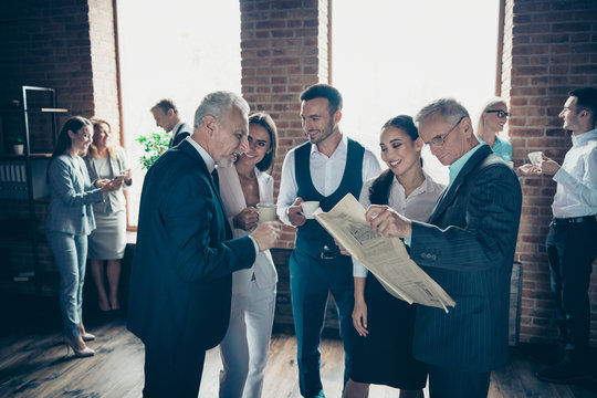 Close up photo diversity age mixed race business people stand together she her he him his best brigade conversation tell speak listening reading beverage interested curious formal wear jackets shirts