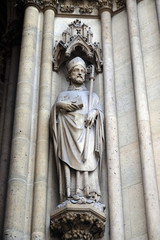 Fototapeta premium Statue of Saint on the portal of the Basilica of Saint Clotilde in Paris, France 