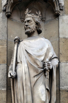 Saint Clovis, the first king of the Franks, statue on the portal of the Basilica of Saint Clotilde in Paris, France 