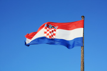 Croatia flag waving on the blue sky.