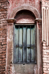 old broken window in wall