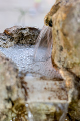 Old stone drinking water fountain 